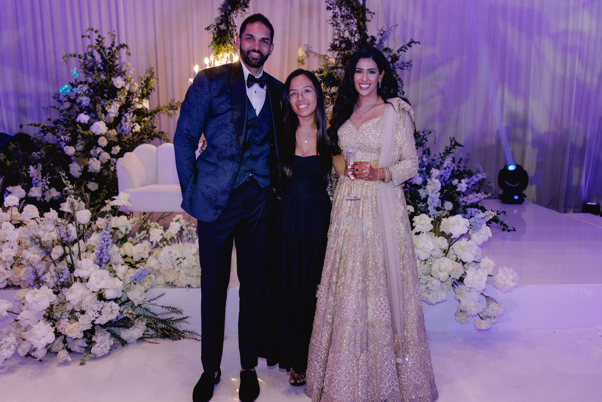 Evening group portrait in the purple-lit reception space