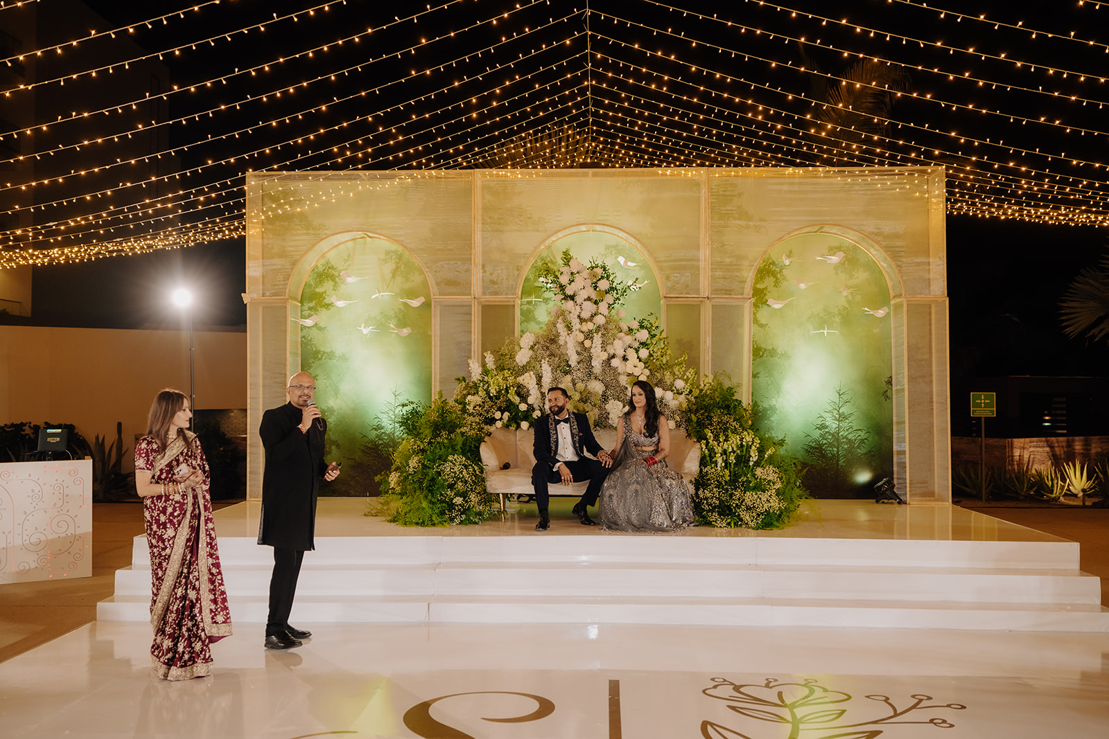Sneha and Apoorv at their illuminated evening reception