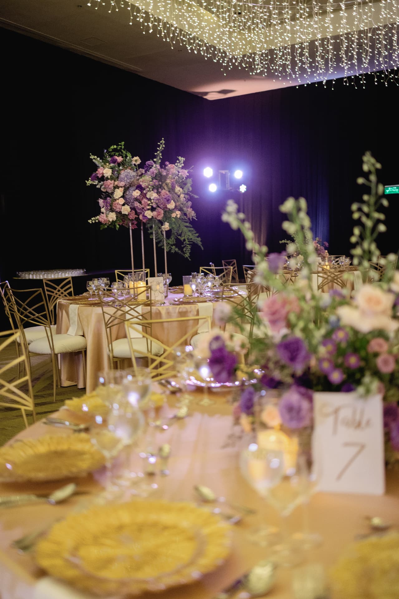 Lavender and gold tablescape with chandelier and flowers