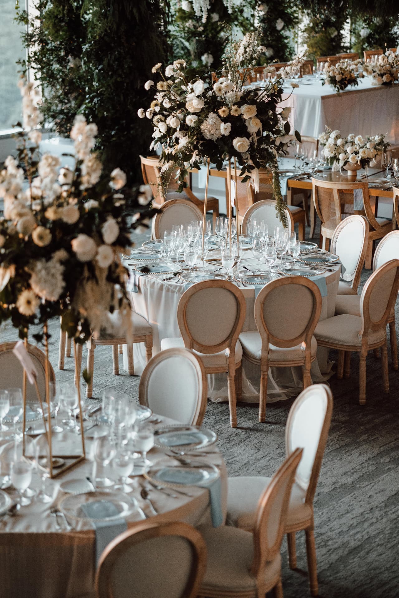 White tablescape with floral centrepieces
