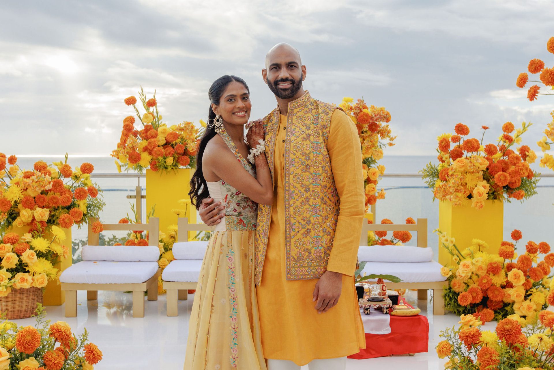 Shivam and Prarthi seated together at the Haldi celebration