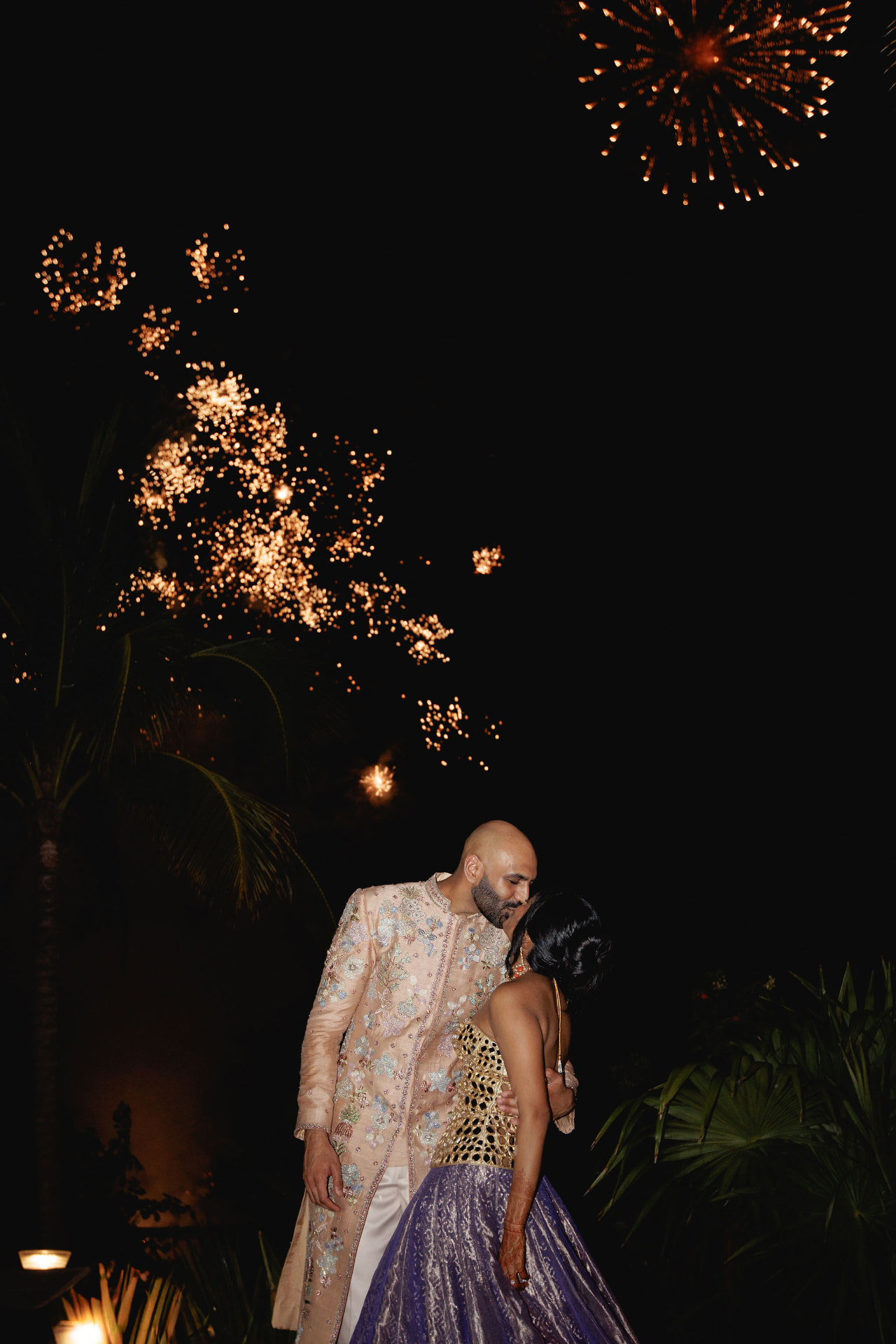 Shivam and Prarthi sharing a kiss beneath fireworks